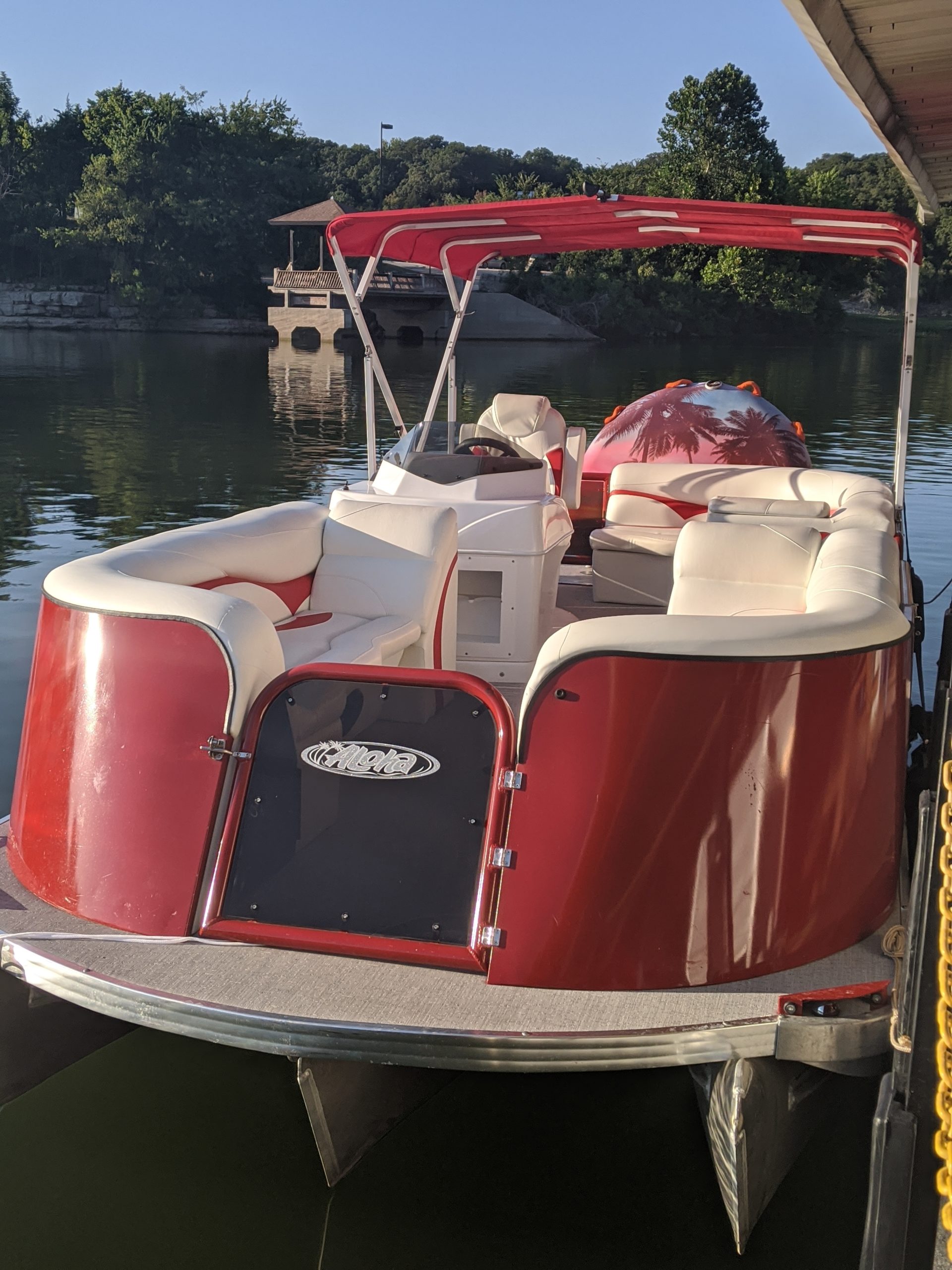 a boat sitting on top of a table next to a body of water