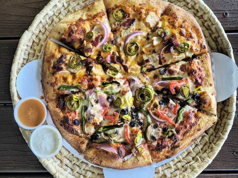 a plate of food with a slice of pizza