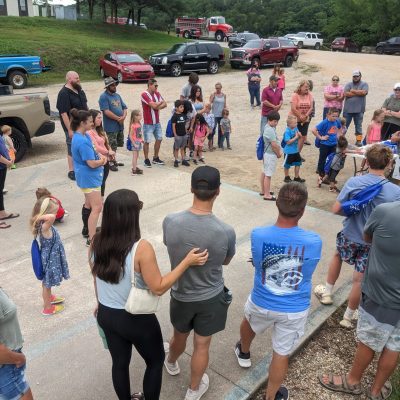 a group of people standing in front of a crowd