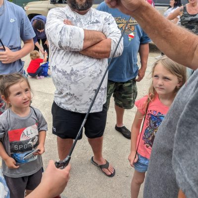 a group of people standing in front of a crowd